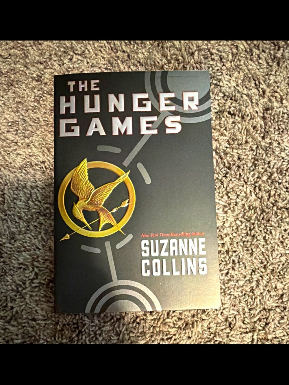 Scholastic Black Cover with Gold Mockingjay Emblem